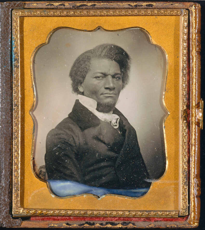 A gold-framed tintype portrait of Frederick Douglass circa 1885
