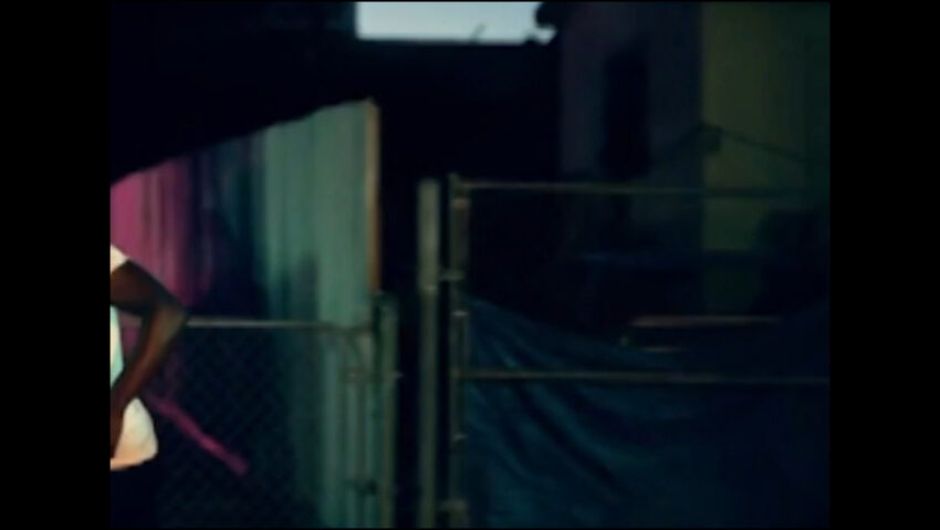 Person moves out of view in a dark area.