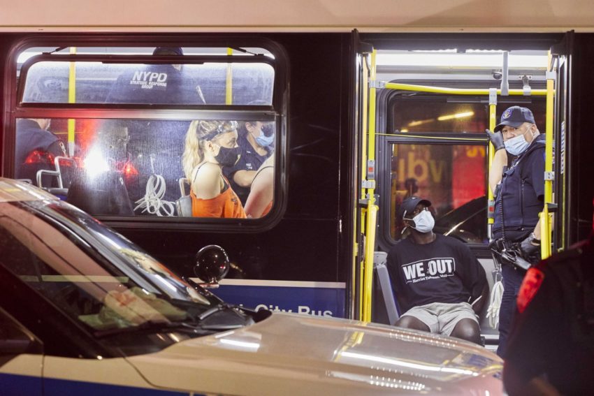 NYPD officers on a subway car
