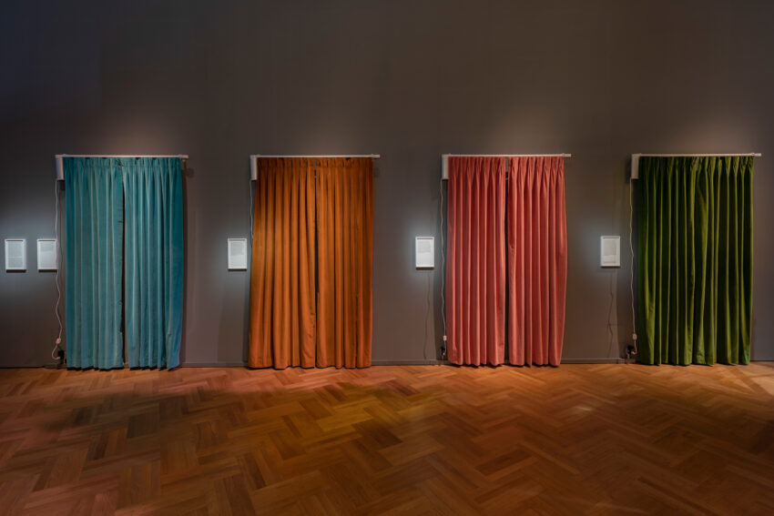 Series of four curtains in blue, yellow, pink, and green
