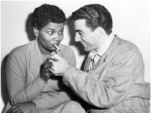Louie Bellson lighting Pearl Bailey's cigarette