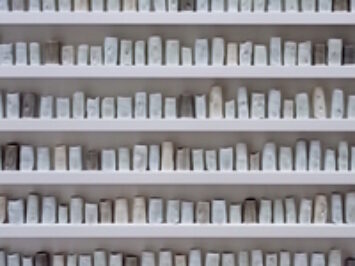 A wall of pottery. A Change in the Weather by Edmund de Waal, 2007.