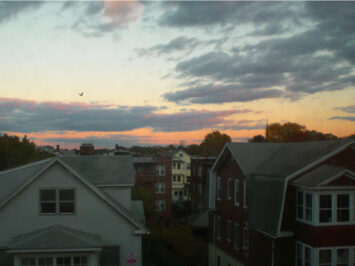 Picture of multiple buildings and houses at sunset