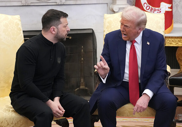 Trump meets with Zelensky in the Oval Office on February 28, 2025. They sit on upholstered yellow chairs.