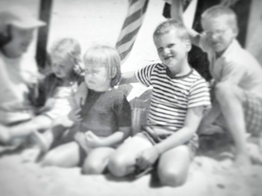 A photo of the author and her brother, with other children
