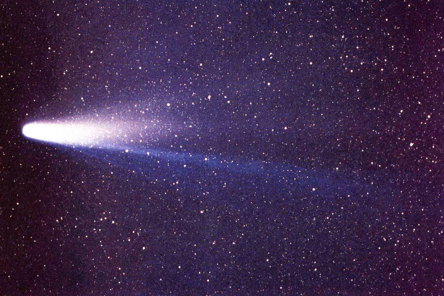 Photograph of Halley’s comet across starry background