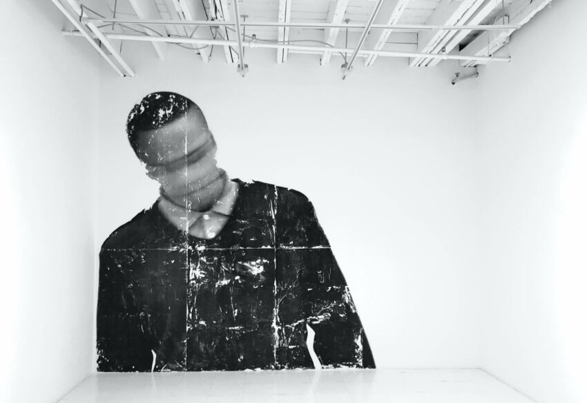 Blurry black and white photo of a man.