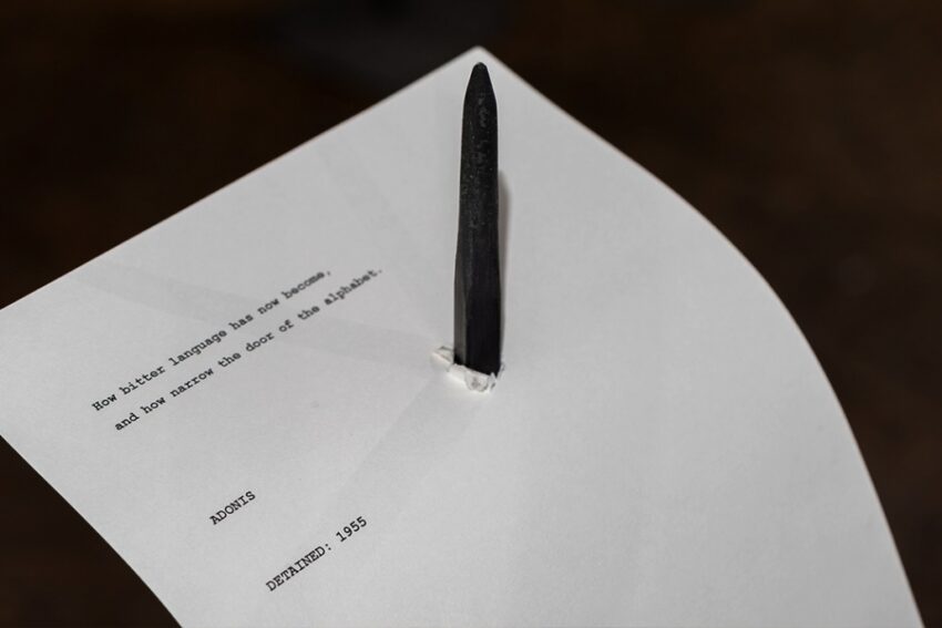 A peice of paper stuck on a metal stand.