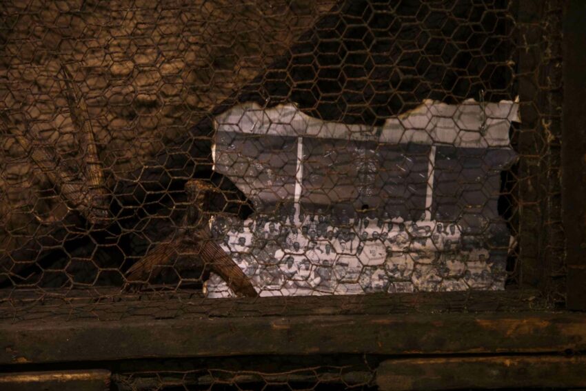 A photo behind fencing.