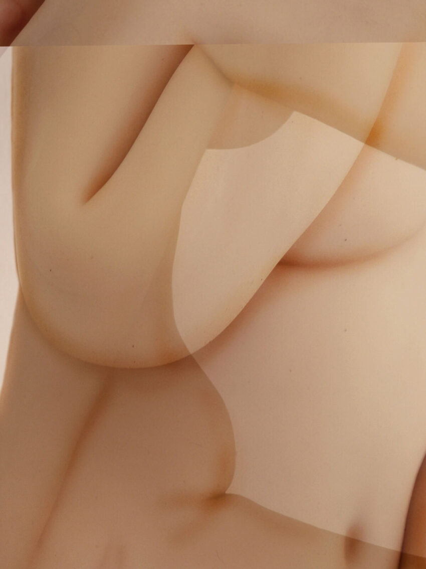 Abstract close-up of nude bodies superimposed over one another