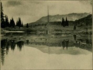 A landscape of a lake and a mountain.